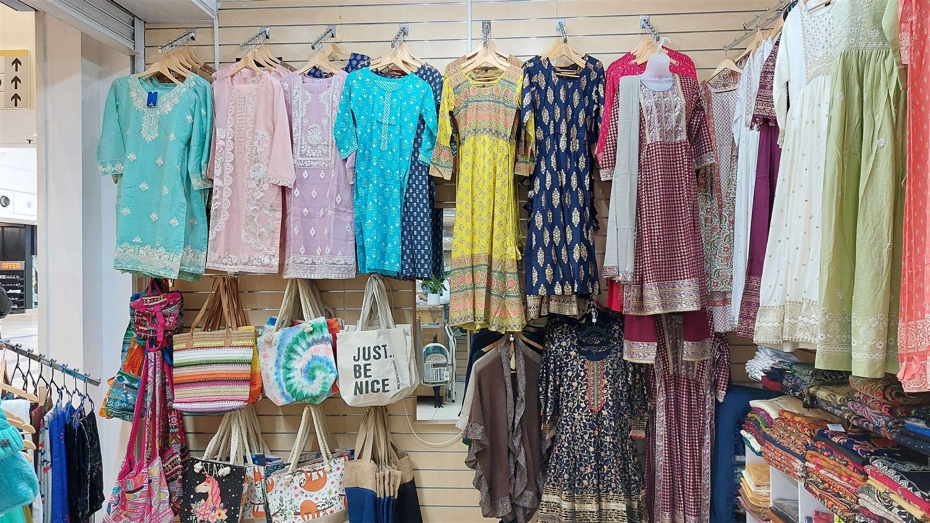 The shop sells dresses, scarves and jewellery
