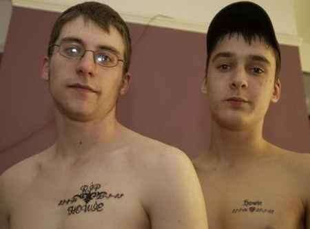 Friends Paul Wallace and Josh Medhurst with their tattoos