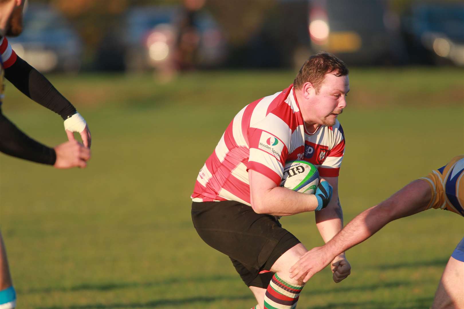 Conner Russon playing rugby for Sheppey in red and white