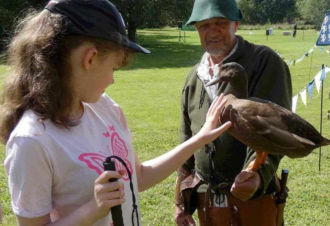 Mark Colyer and Dog the duck with the blind girl at a reenactment. Picture: Mark Colyer