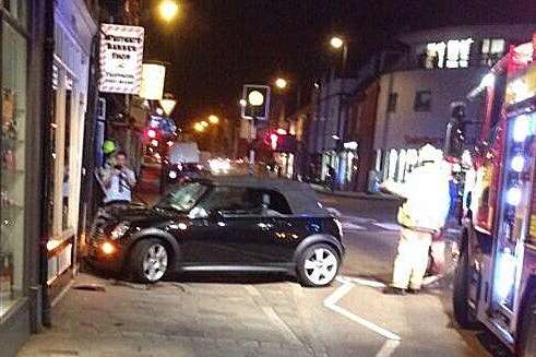 A Mini Cooper crashed into a charity shop in Canterbury. Picture: @pmichaelas
