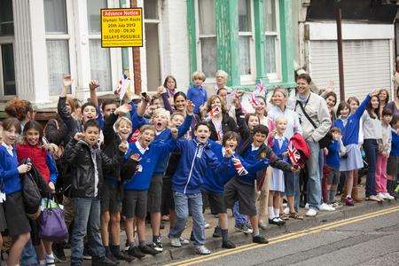 Crowds prepare to welcome the Olympic torch in Canterbury Street, Gillingham. Picture by Alfredo Perez
