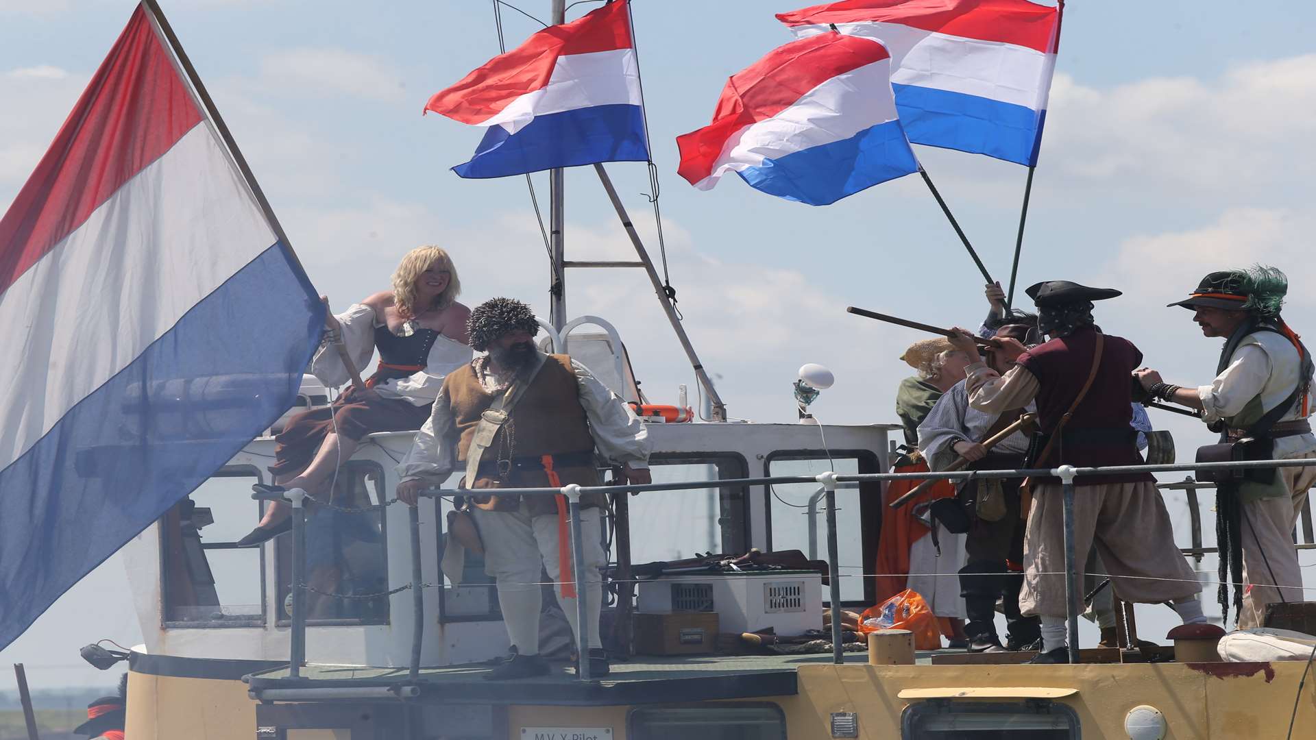 Sheppey Pirates, with Dutch flags flying, reenact a part of the Dutch flotilla invading Queenborough