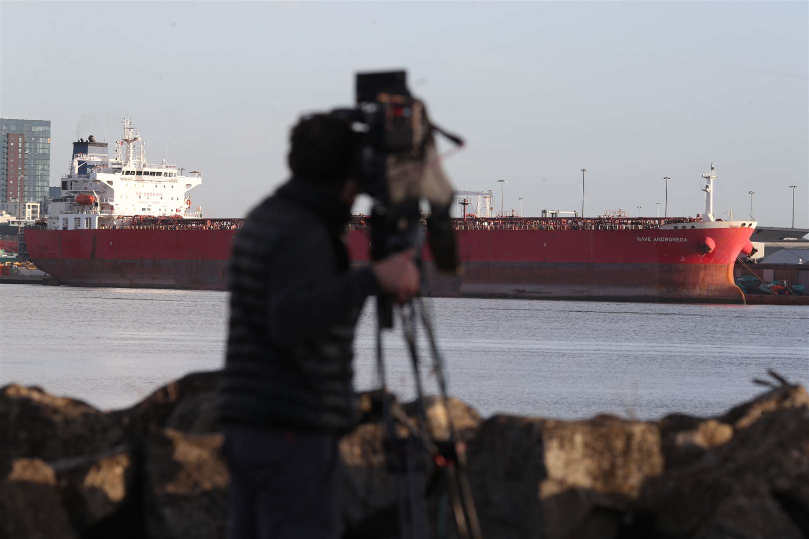 A cameraman films the Nave Andromeda oil tanker in Southampton (Andrew Matthews/PA)