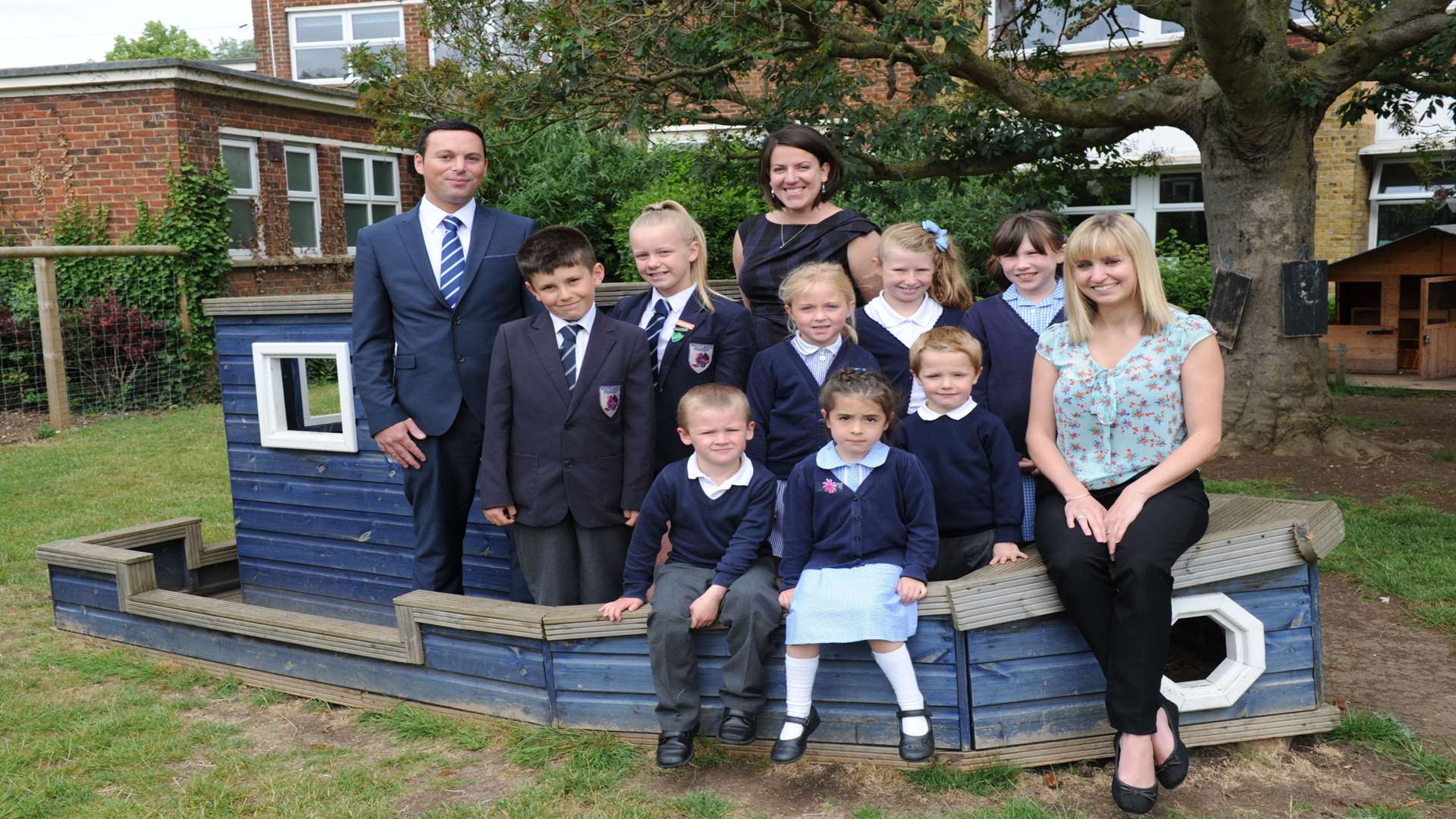 Deputy head Ben Broughton, interim head Louise Hopkins and Assistant reception head Victoria Chant with a group of Westlands Primary pupils