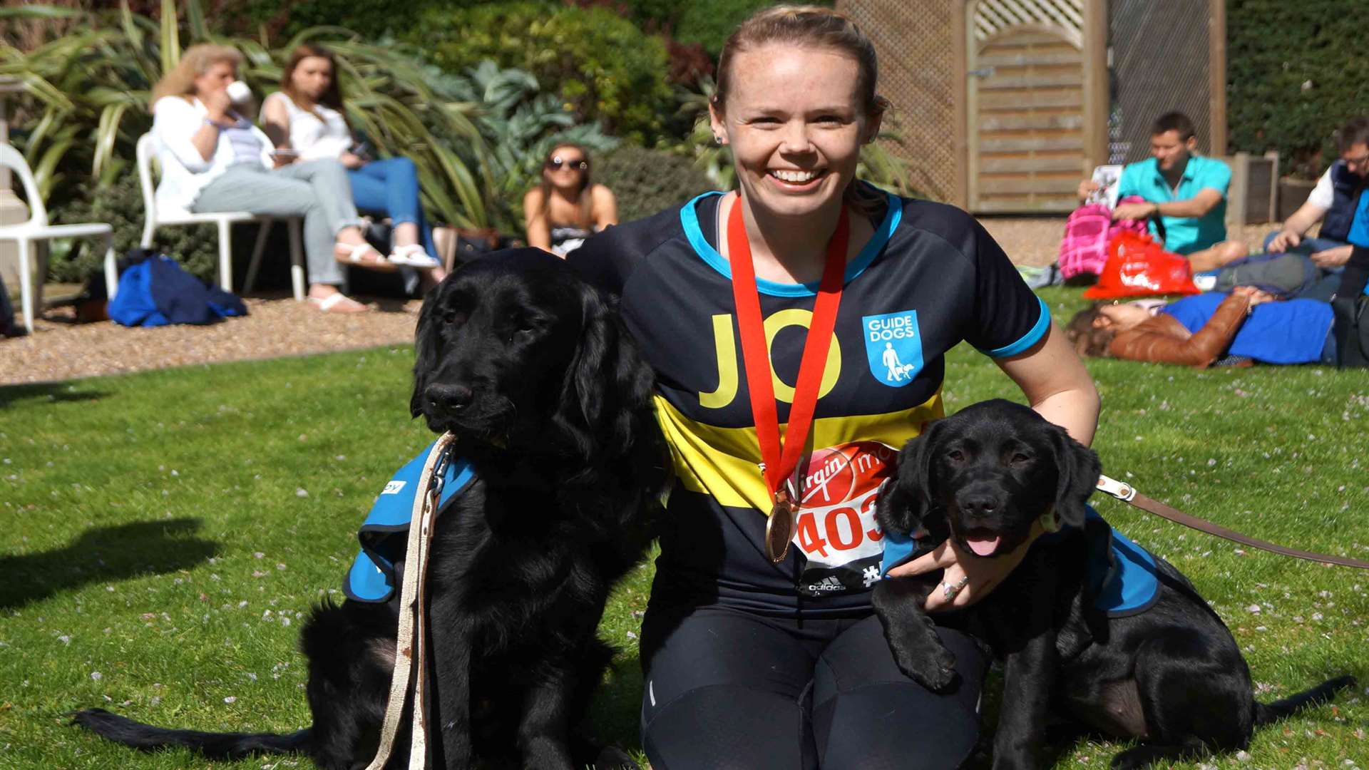 Trainee guide dogs from Medway greeted marathon runners taking part for Guide Dogs