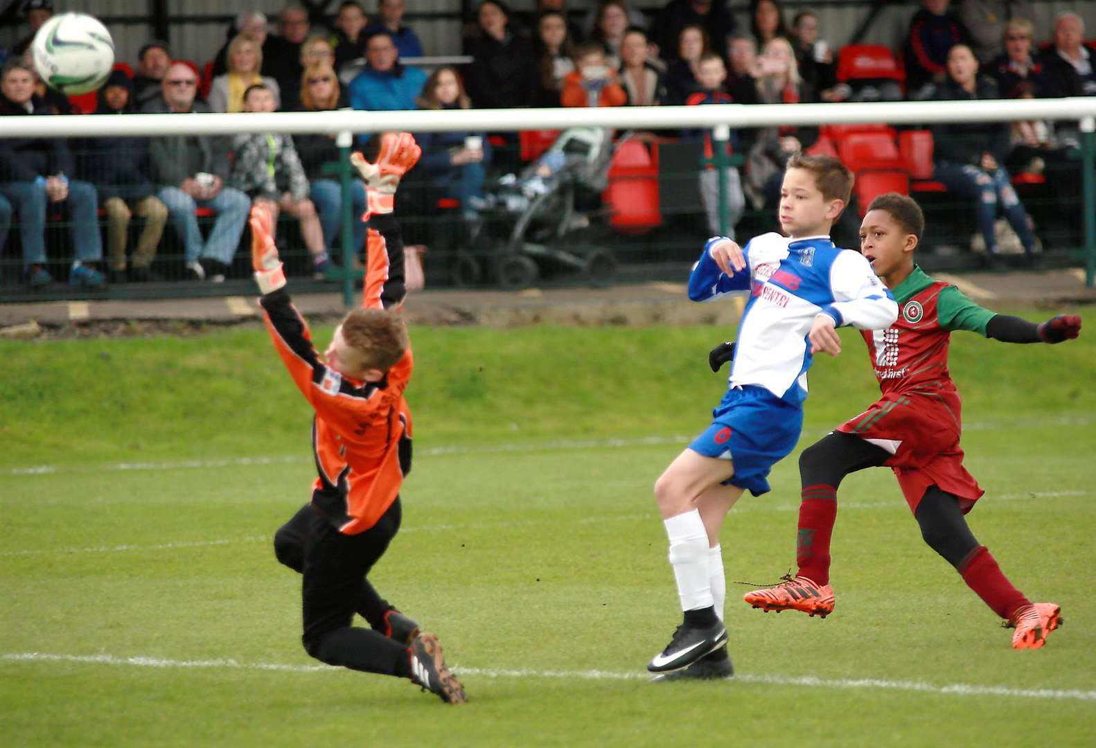 Cobham Colts (white/blue) take on Bredhurst Juniors in the Under-11 trophy event. Picture: Phil Lee FM1660498