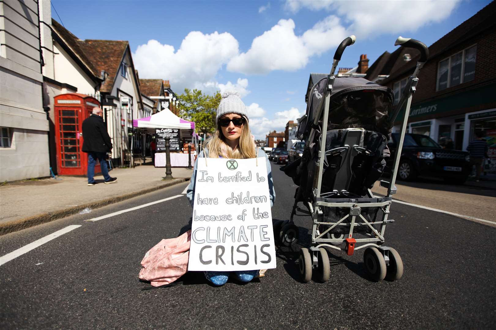 A lone woman with a pushchair blocked traffic in Sevenoaks, as part of countrywide action by Extinction Rebellion. Image from Extinction Rebellion