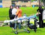 Emergency rescuers treat a pupil at the scene