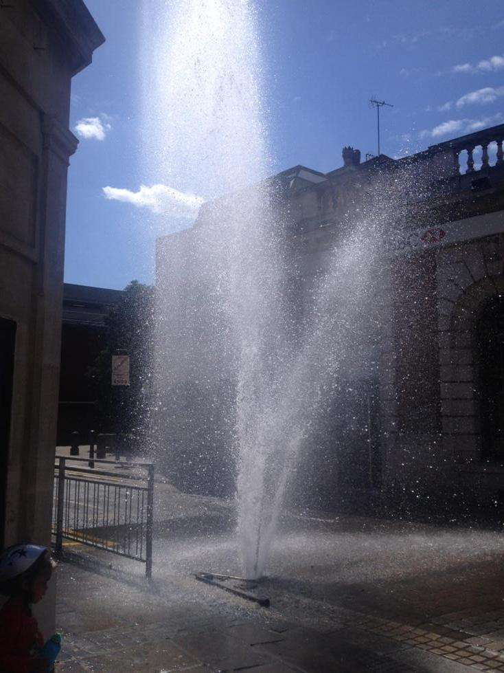 The burst pipe saw water fly up higher than the buildings. Picture: @lukesteggles