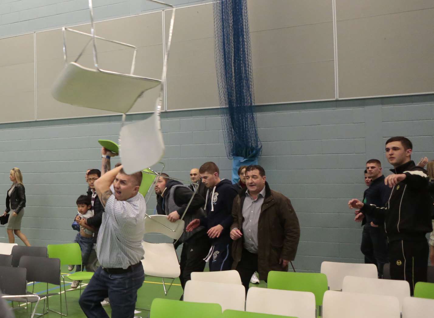 Chairs fly through the air as the violence escalated