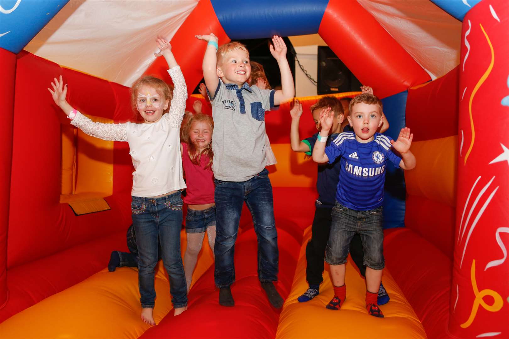 Children enjoy the bouncy castle at the Jimmy Gray Memorial Day.