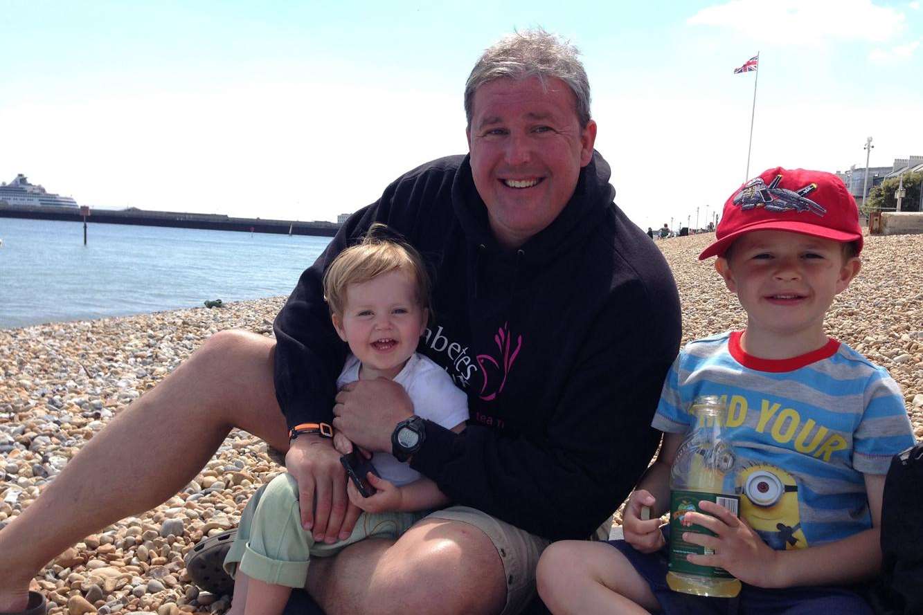 Aylesford dad Nick Alford who swam the Channel for charitY with Esmee (right) and Jake (left)