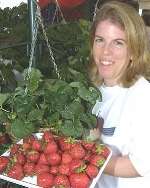 Charlotte Bullock, from Matfield, shows off her strawberries. Picture: JOHN WESTHROPE