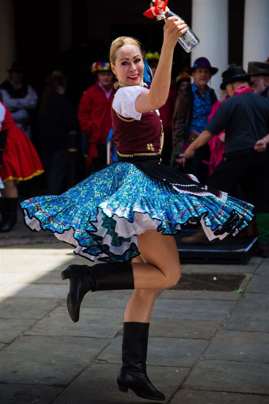 A folk dancer twirls on the High Street. Photo by Andrew Beck (9865325)