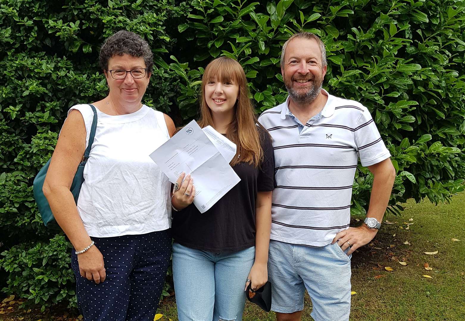 Holly Clark from Sutton Valence School, pictured with her mum Marie and dad Steven, achieved six 8s and three 9s