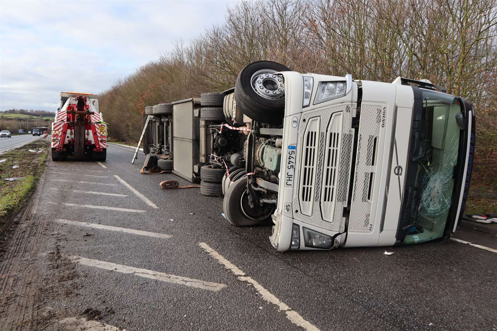 Recovery crews arrive for an overturned lorry blocking the Bobbing slip road of the A249