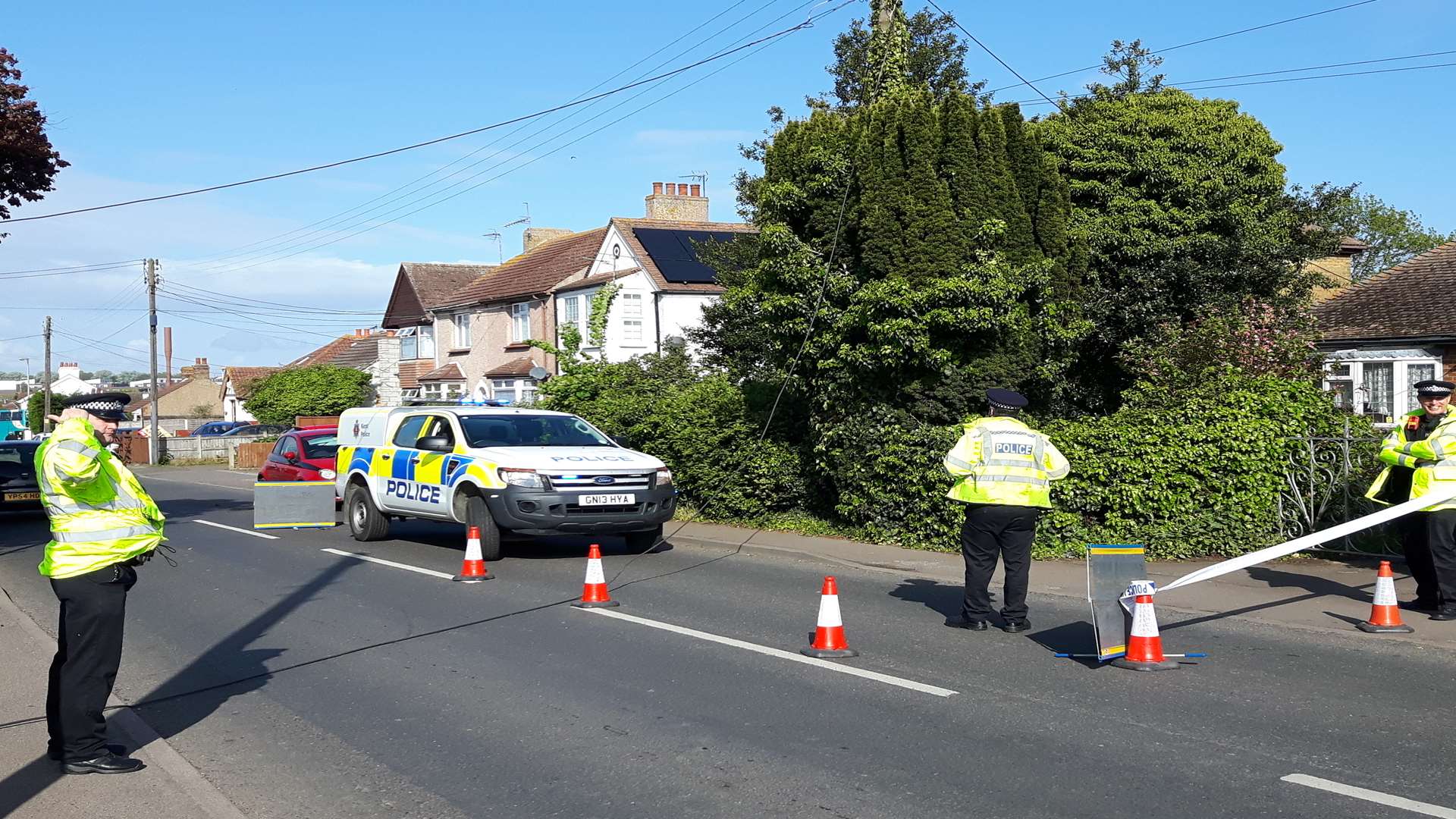 Police direct traffic after a power cable fell across Minster Road, Minster, this morning.