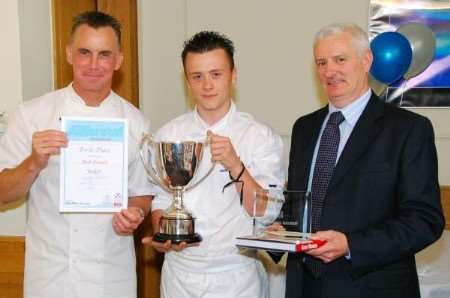 Winning junior chef Jack Cunnell is presented with his certificate and trophy by Gary Rhodes and Simon Bean of contest sponsors P&O.