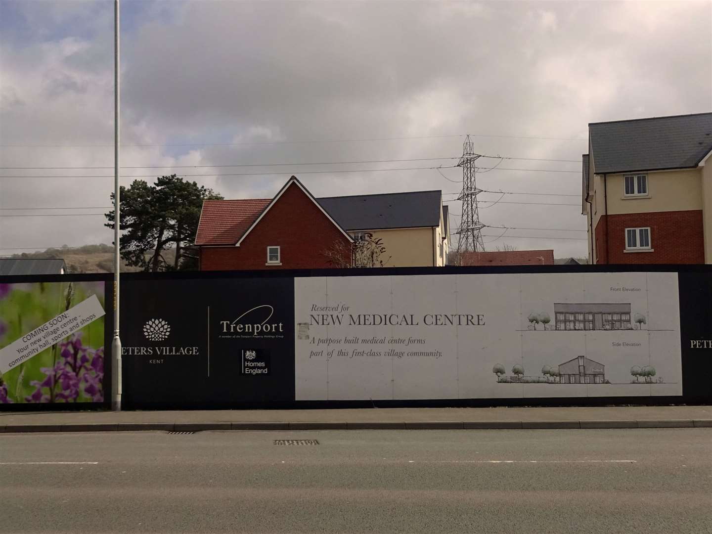 Hoardings around the site of the proposed medical centre at Peters Village