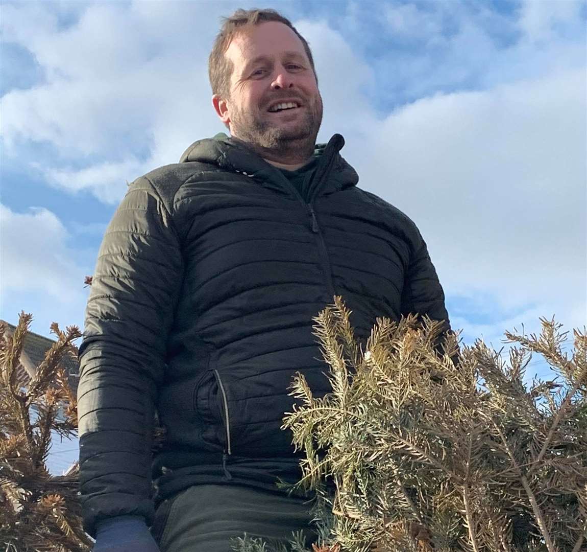 Phil Webb helped to move Christmas trees from the streets of Whitstable. Picture: Chris Cornell