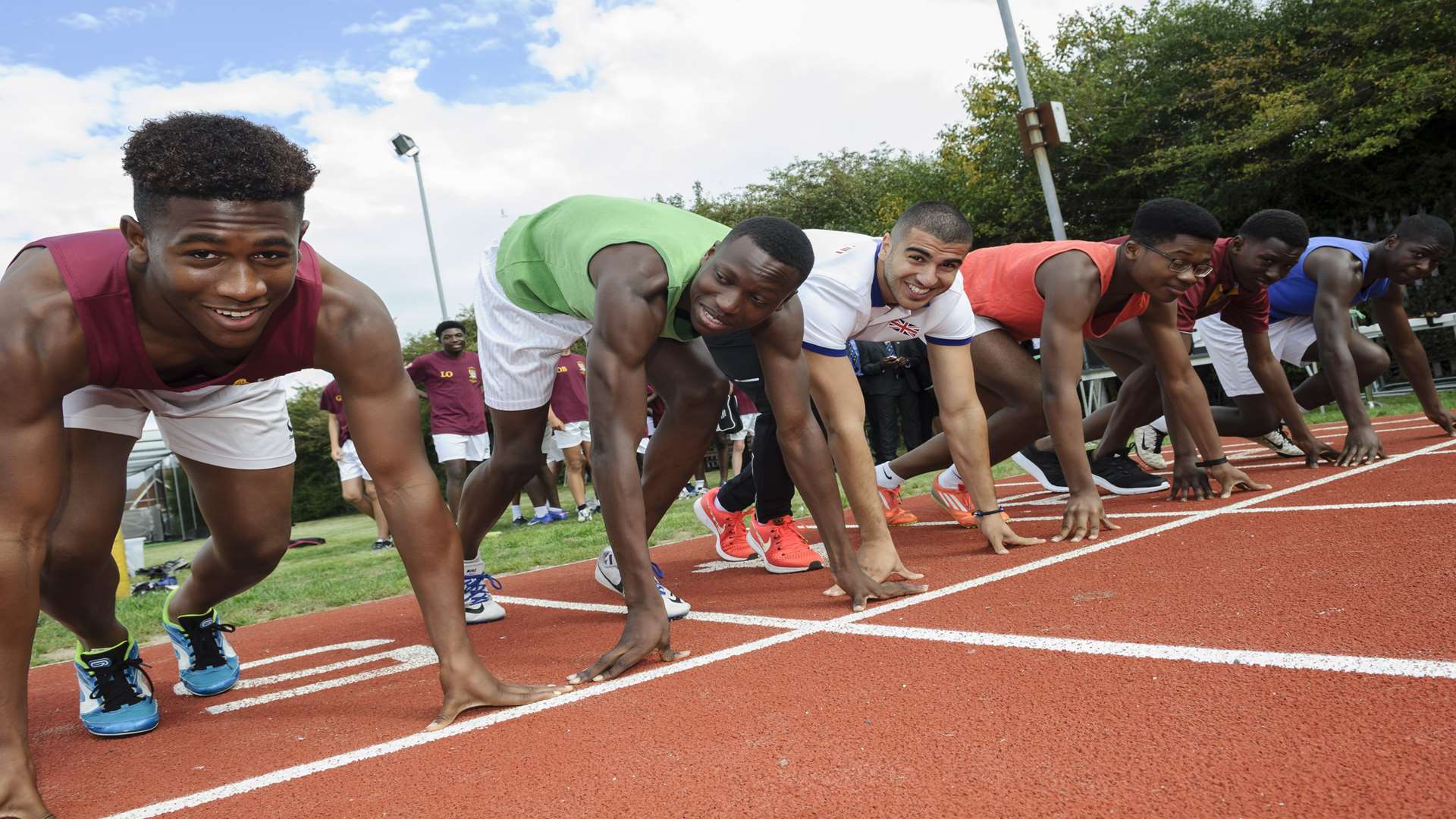 Adam Gemili lines up with Year 11 pupils for a race