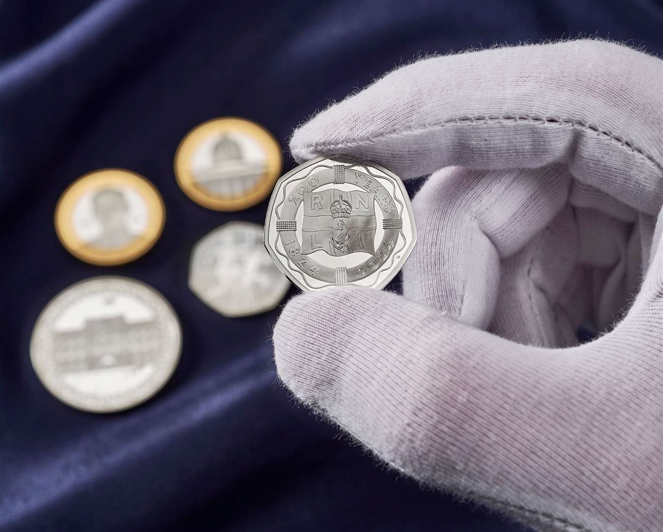 Created by John Bergdahl, the RNLI 50p coin marks 200 years of saving lives at sea, displaying the RNLI flag surrounded by a life ring. Picture courtesy of Royal Mint