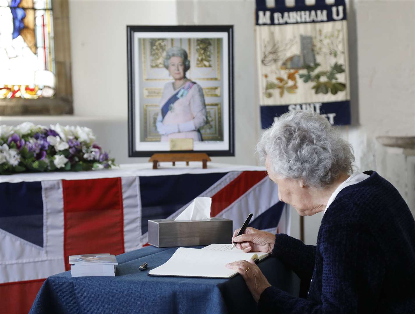 Jean Sanders. 82, signs the book of remembrance at St Margaret's Church, Rainham Picture: Roger Vaughan