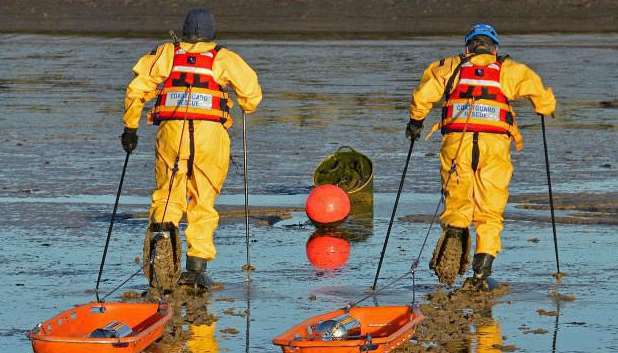 Coastguards training for mud rescue. Stock pic.