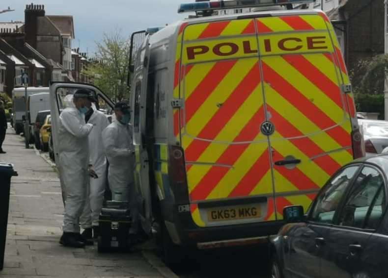 Officers have been seen putting on white protective suits