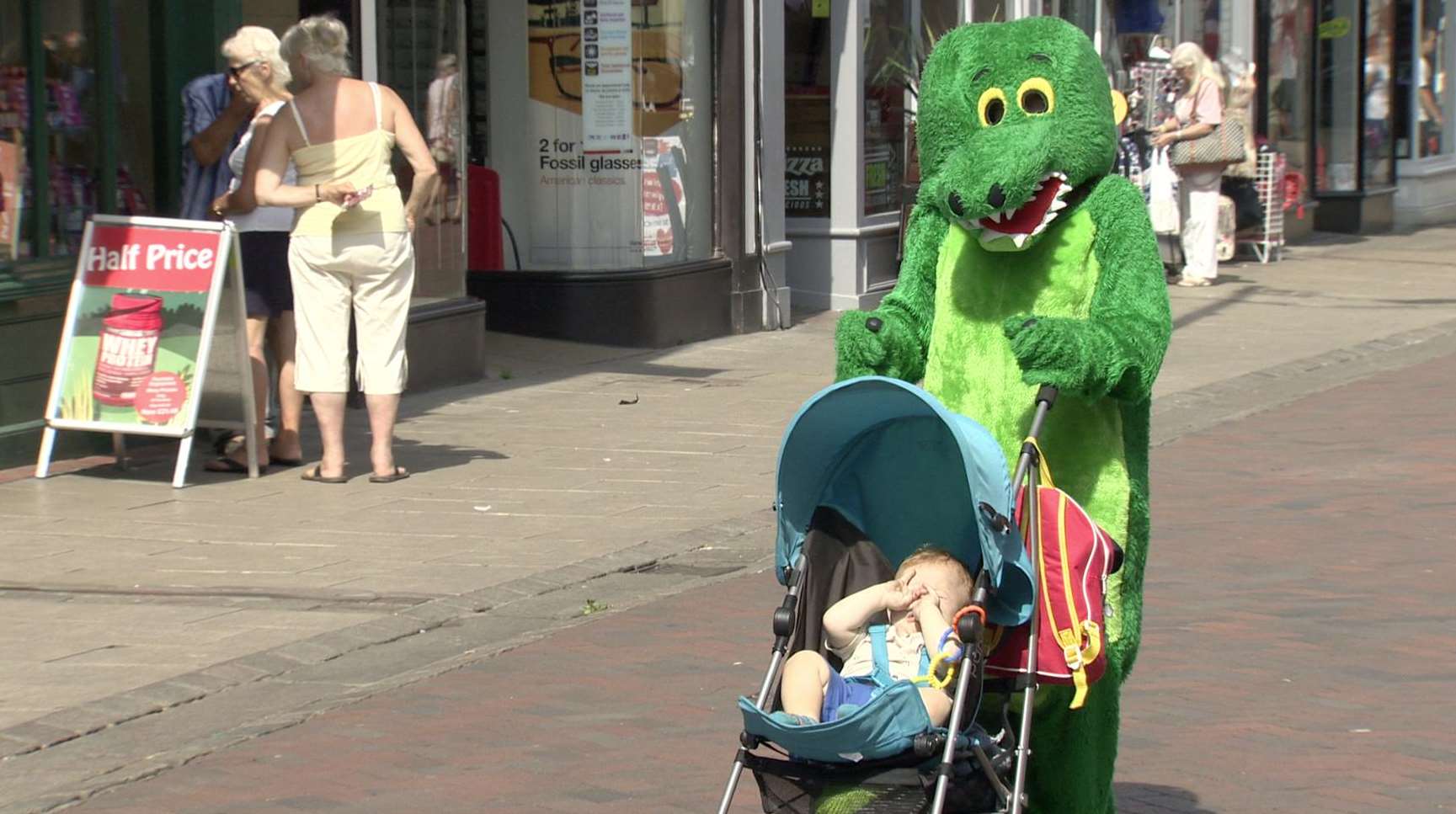 Bethany Luney walks through Canterbury in a monster suit