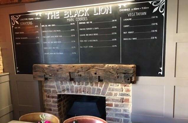 The main menu was clearly displayed above one of the many open fireplaces, including four vegetarian options