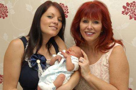 Virginia Howes (right) helped deliver daughter Sophie Harrell's baby Jesse