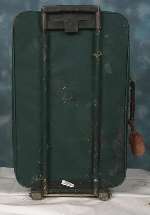 The dark green suitcase has a brown trim