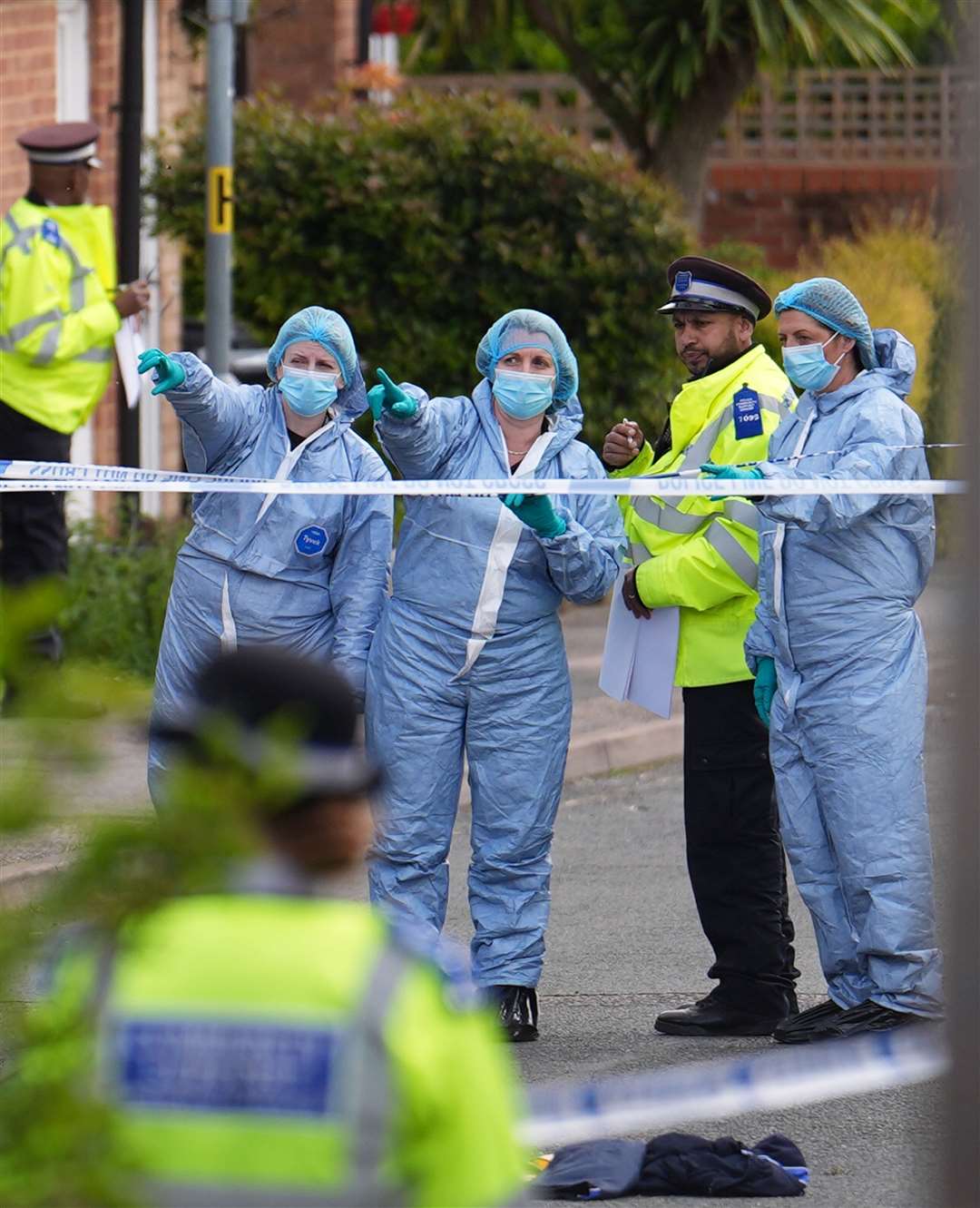 Forensic investigators in Laing Close in Hainault, east London (Jordan Pettitt/PA)
