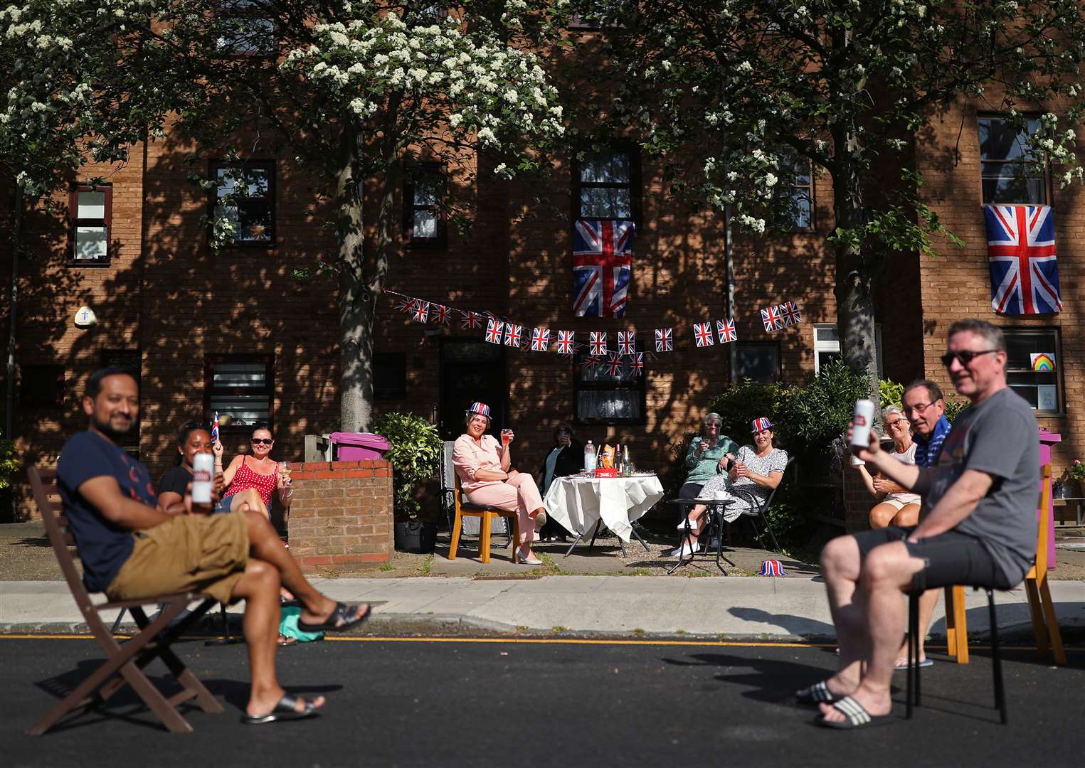 Residents of Saunders Ness Road in the Isle of Dogs, east London, throw a socially distanced street party (Yui Mok/PA)