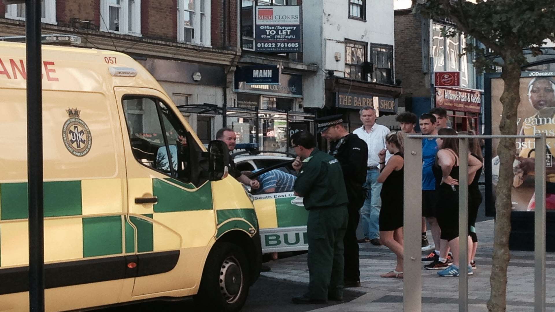Ambulance staff and police in Maidstone High Street
