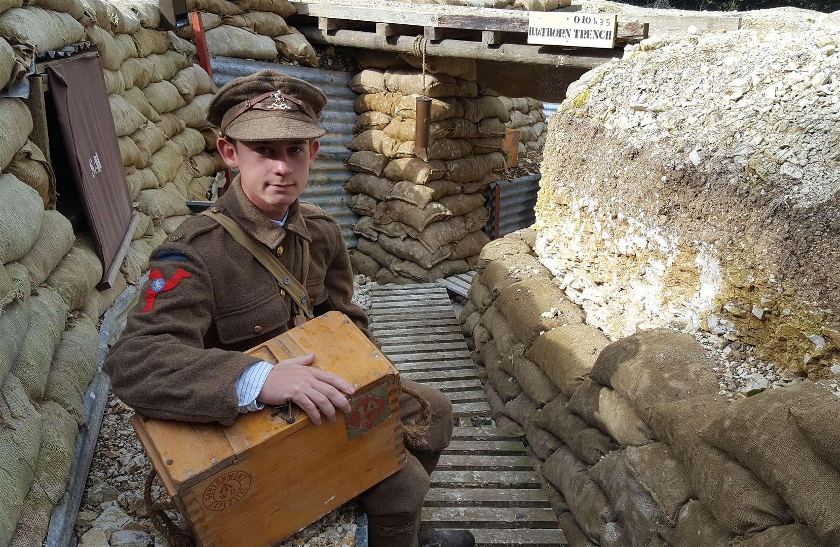 Toby Dingle sits in the trenches he has helped recreate following a visit to the Somme