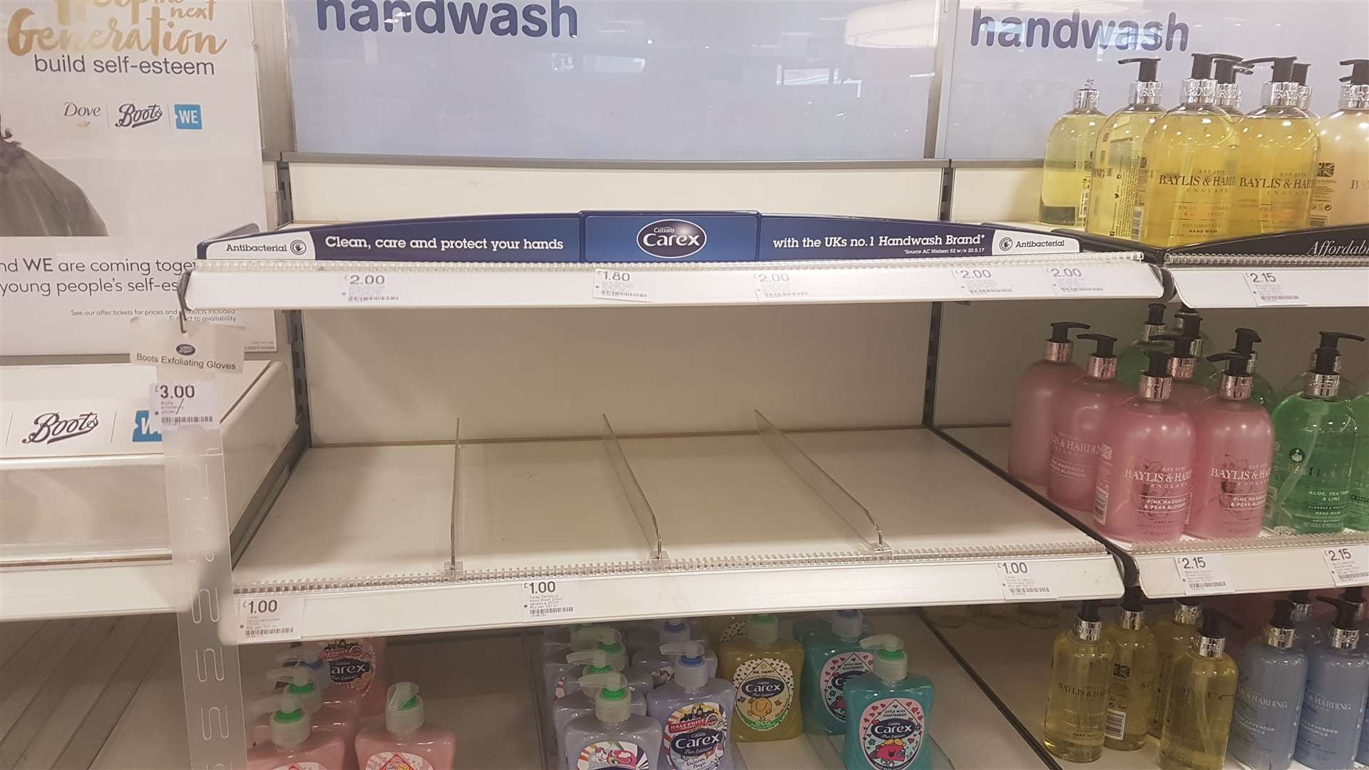 Empty hand gel shelves are a common sight
