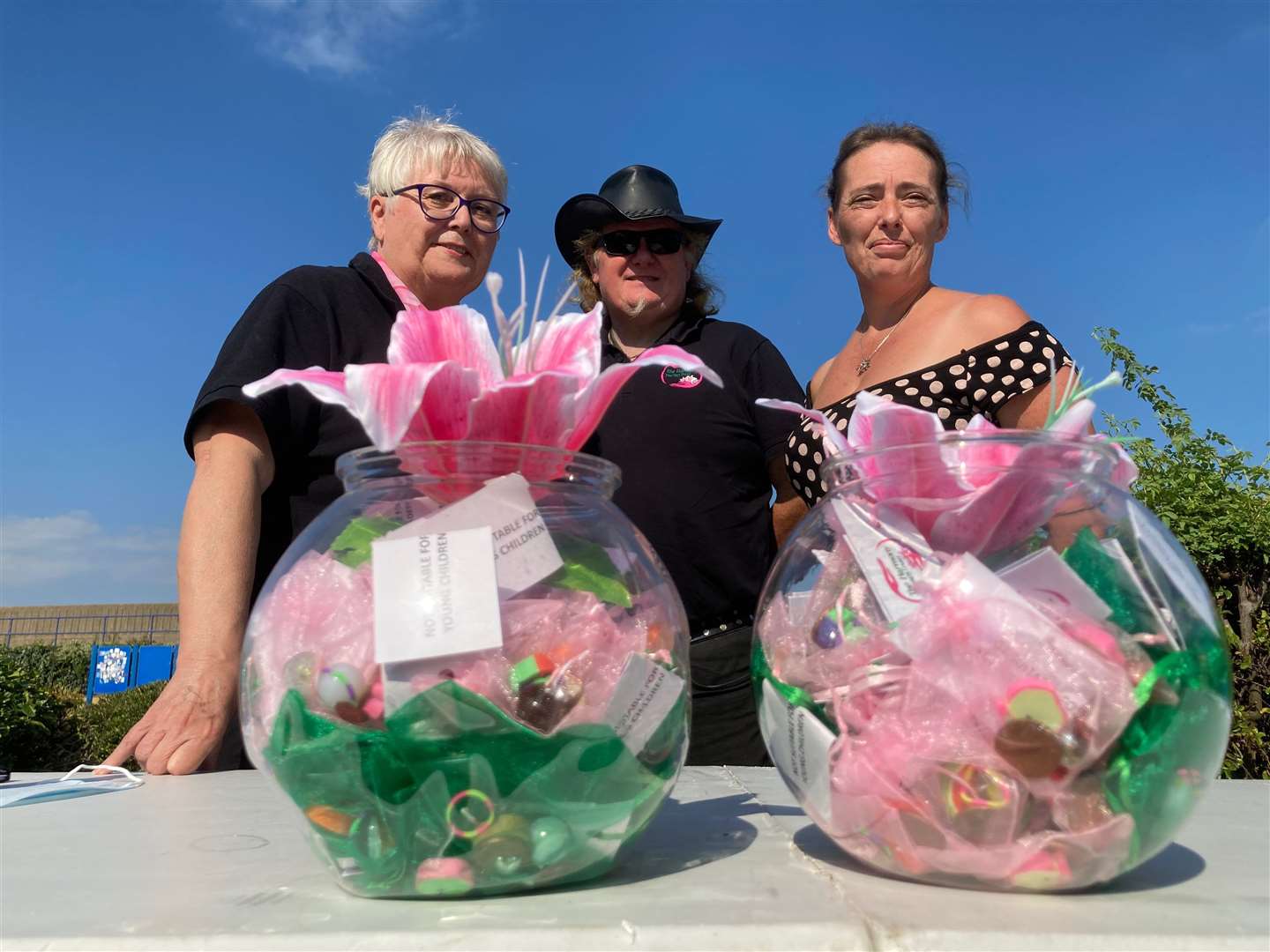 Wellbeing advice from the Harmony Therapy Trust was on offer at the Great Big Green Week event at Beachfields seafront park, Sheerness. Picture shows founder Dawn Cockburn, left, with volunteers Tony Stubley and Kelly Smith in front of glass globes containing the £1 Harmony Happiness Kits