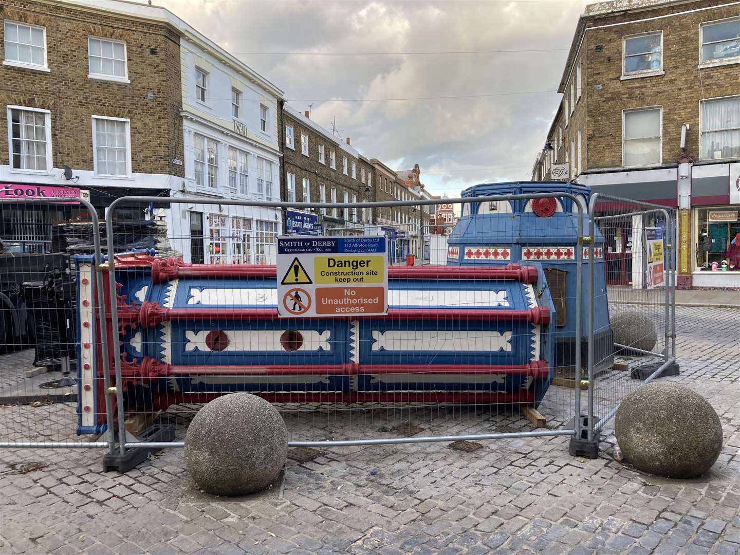 Day three: Sheerness town centre looks strange with its 119-year-old clock tower lying horizontal on the ground waiting to be taken away for restoration by Smith of Derby