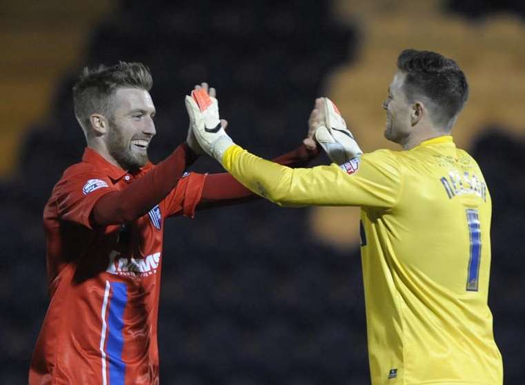Gillingham players Matt Fish and Stuart Nelson celebrate winning the penalty shoot out Picture: Barry Goodwin