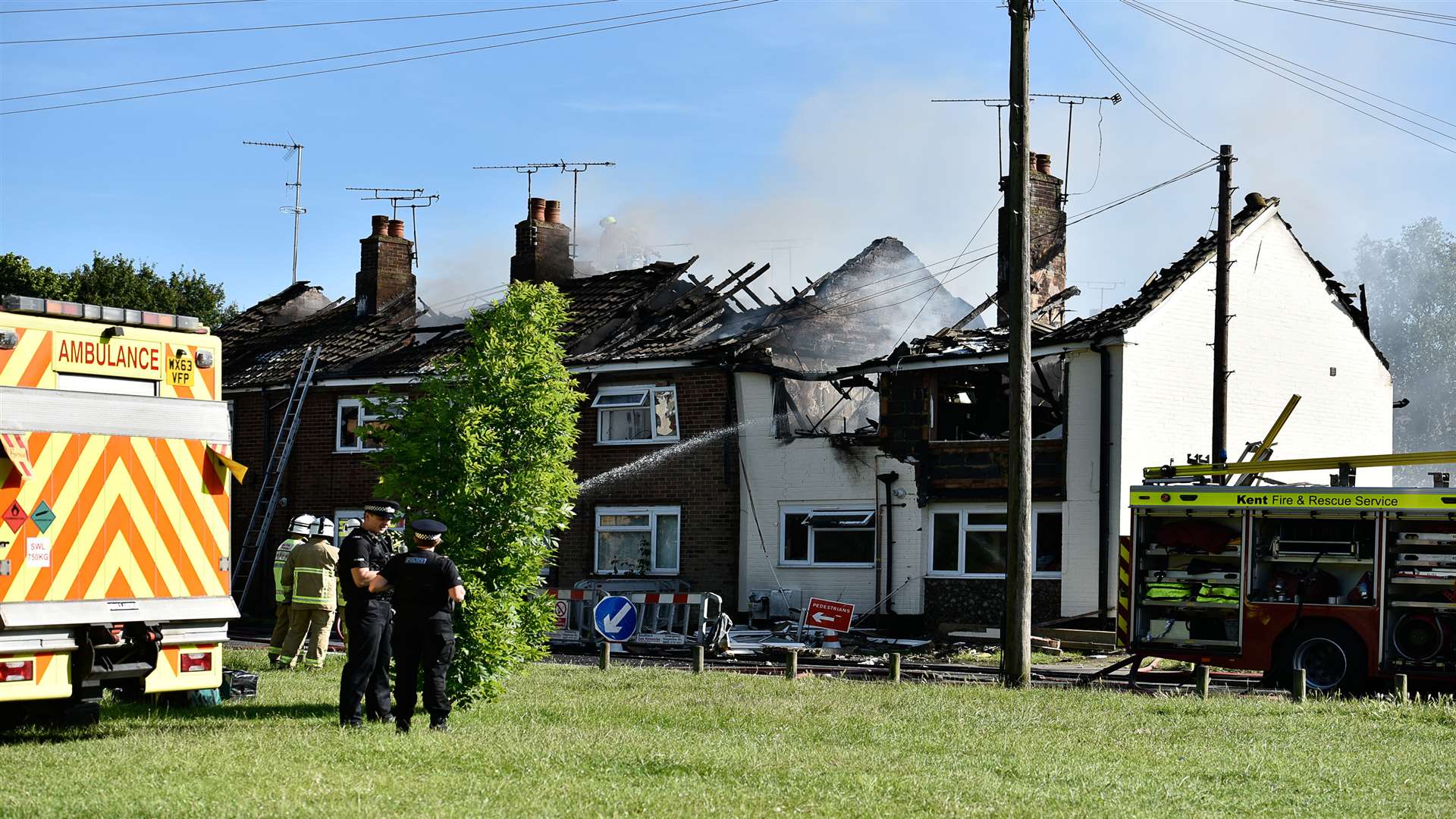 A suspected gas explosion gutted a row of homes
