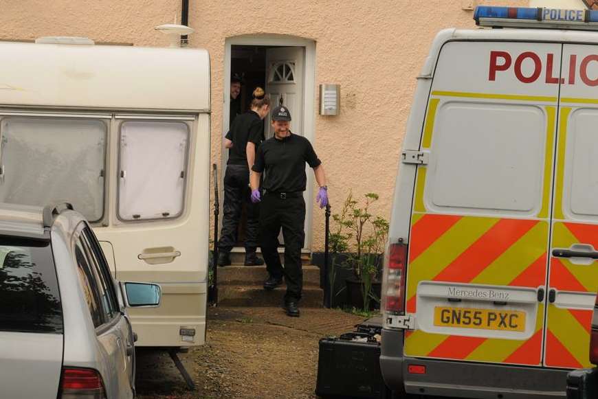 Police investigating the murder search Colin Ash-Smith's parents' home in Dartford last year