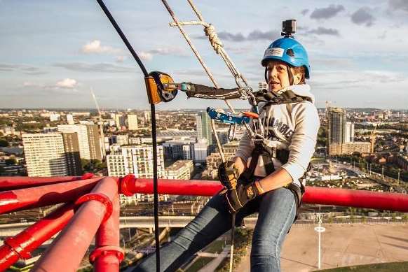 Rachel abseling 115m down the big red ArcelorMittal Orbit structure at Queen Elizabeth Olympic Park