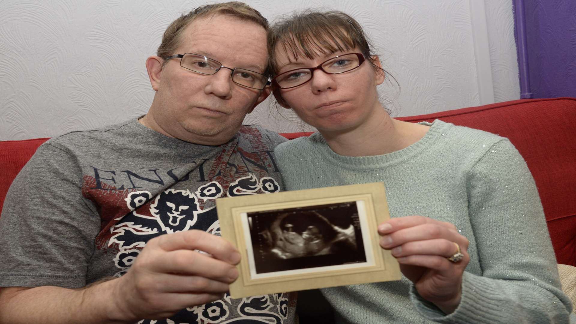 Scott Luers and Jamie Sykes, who face being separated by a visa battle, are expecting a baby