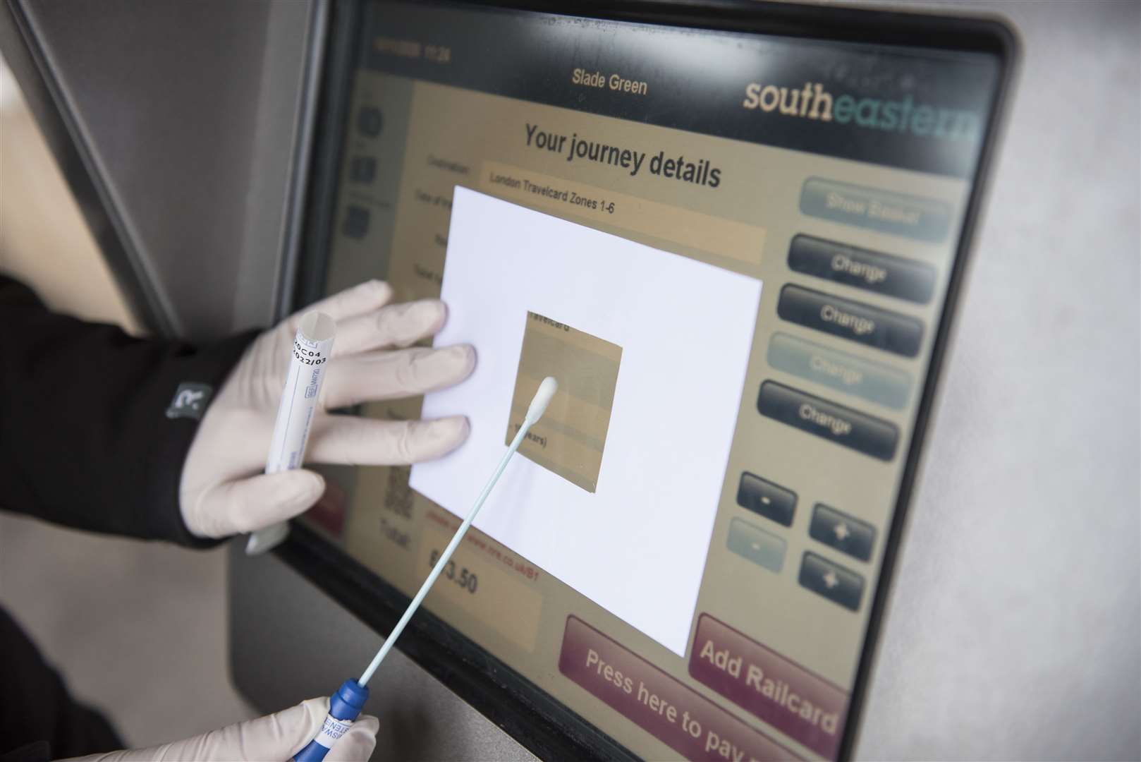 Swabbing a ticket screen at a Southeastern railway station