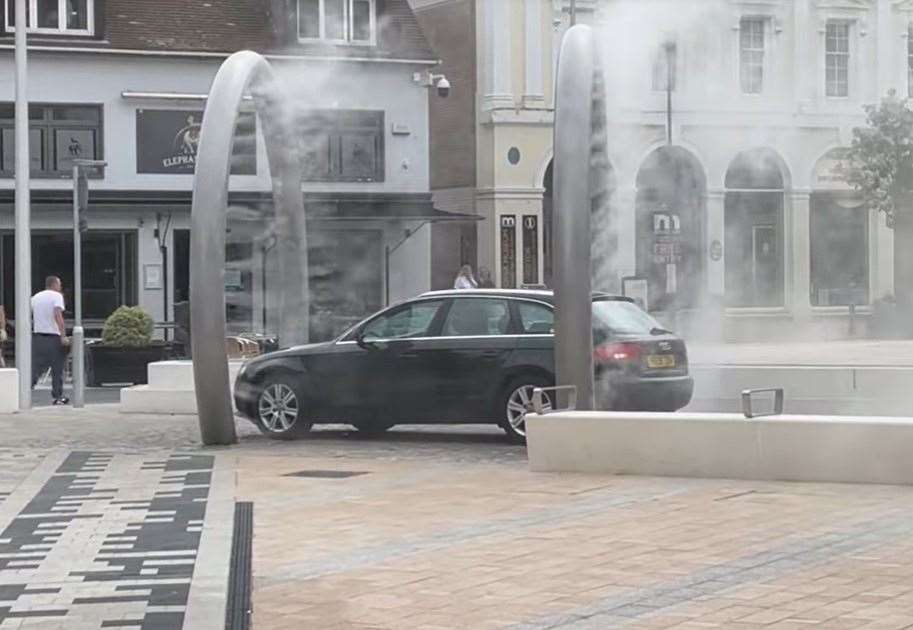 The black Audi gets a free car wash in Dover's Market Square. Picture: Jake Michael