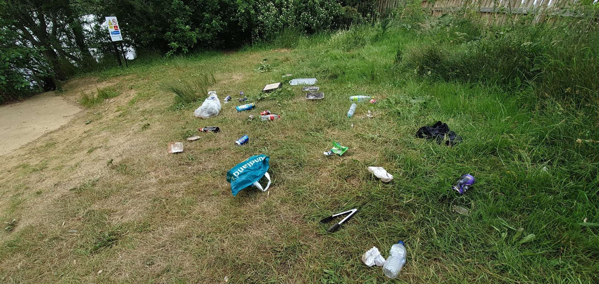 Rubbish strewn across the grass at Leybourne Lakes in Snodland. Picture: Tonbridge and Malling Borough Council
