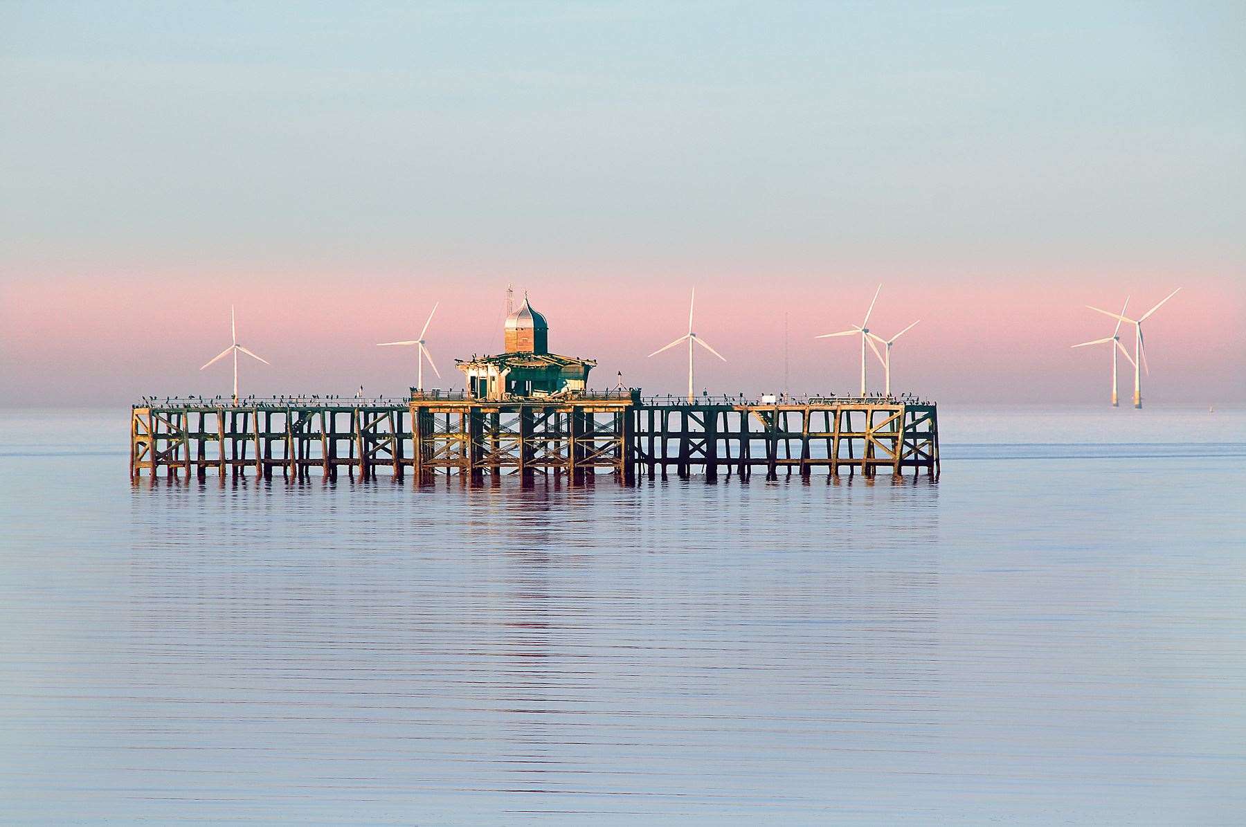 An image of the derelict pier with the wind farm on the horizon. Picture: Tim Edwards